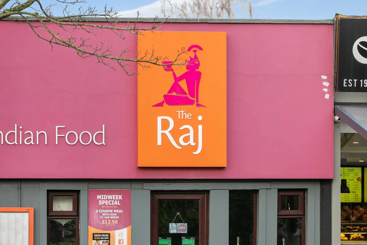 The Raj restaurant illuminated signage in Belfast
